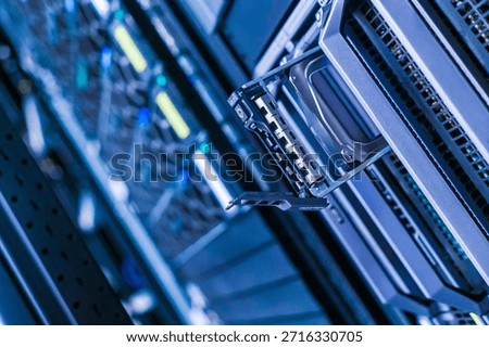 Close-up view of a server rack showcasing a hard drive in a modern data center. High-tech design reflects the innovation in storage technology.