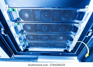 A close-up view of server racks featuring multiple data storage units inside a modern data center, showcasing technology and efficient hardware arrangement.
