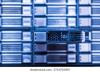 A close-up view of a server unit within a data center, showcasing advanced technology and design. The image represents various aspects of server management and operational efficiency.