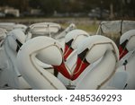 A closeup view of several swan boats, seen in Echo Lake Park, Los Angeles, California.