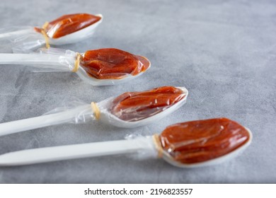 A Closeup View Of Several Tamarind Candy Spoons.