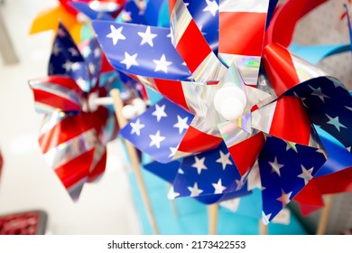 A Closeup View Of Several Toy Pinwheels Featuring The American Flag Design, Seen At A Local Retail Store.