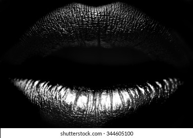 Closeup view of sexual beautiful female open closed lips isolated on studio background black and white, horizontal picture