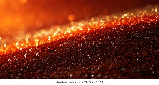 Close-up view of shimmering, glowing particles in shades of orange, red, and gold, creating a sense of movement and energy.