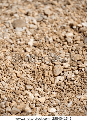 A close-up view showcasing the diverse textures and colors of gravel at a construction site.
