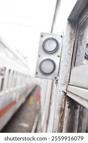 close-up view of a side wall train , with blurred windows and blurred side wall train as background