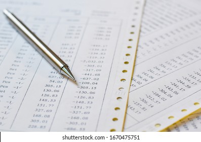Close-up view silver pencil on Documents negative numbers and loss budget. - Shutterstock ID 1670475751