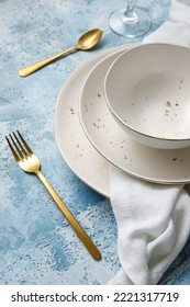 Closeup View Of Simple Dinnerware On Blue Table