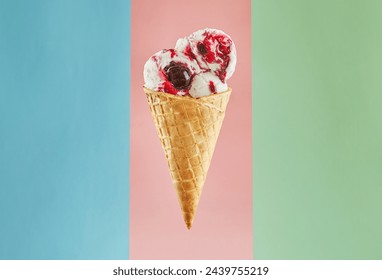 A closeup view of a single ice cream cone with two scoops of strawberry and vanilla ice cream, topped with a decadent drizzle of rich chocolate sauce. Isolated on a pastel pink background. - Powered by Shutterstock