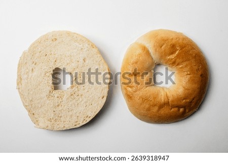 Closeup view of slice of bagel breads isolated over white background. Top and middle part. Top view
