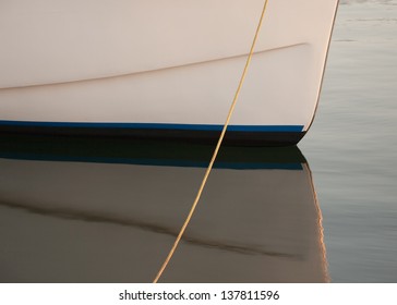Closeup view of small boat hull and reflection