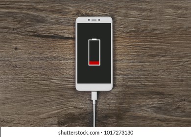 Close-up View Of Smartphone Charging Low Battery Level