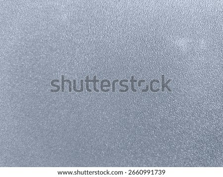 Close-up view of smooth gray surface texture in even lighting