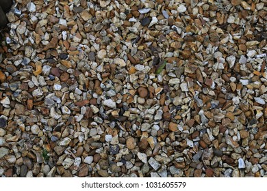 A Closeup View Of Some Multicoloured Pea Gravel On A Garden Path.