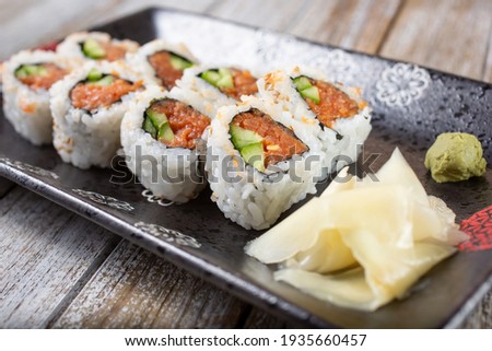 A closeup view of a spicy tuna roll.