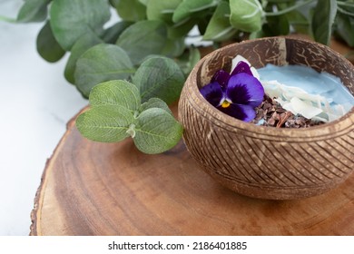 A closeup view of a spirulina yogurt bowl, on the right side of the frame.