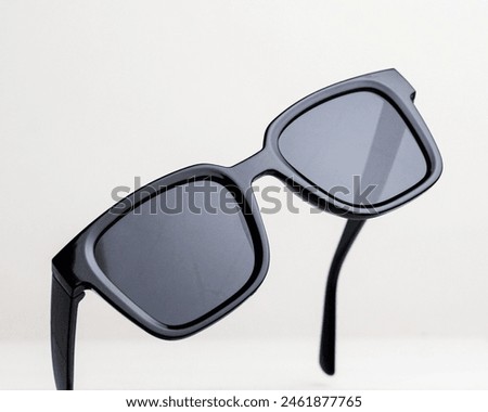 Close-up view of sunglasses from side angle, isolated on white background