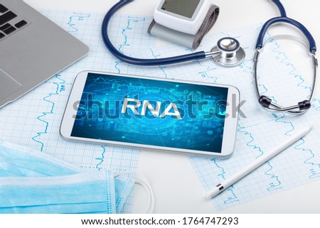 Close-up view of a tablet pc with RNA abbreviation, medical concept