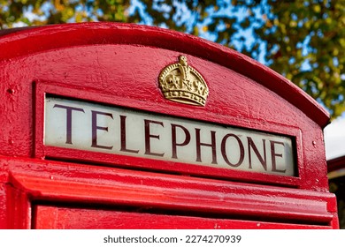 Close-Up view of Telephone sign on Red Telephone Box in London,UK - Shutterstock ID 2274270939