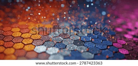 A close-up view of a textured hexagonal surface with a gradient of colors from orange to blue and pink, illuminated by sparkling bokeh lights.