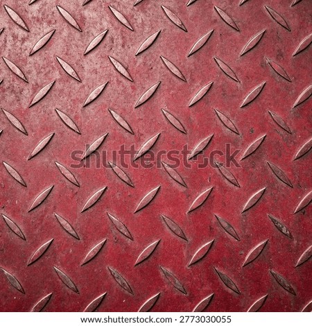 Close-up view of a textured metallic surface with diamond plate pattern
