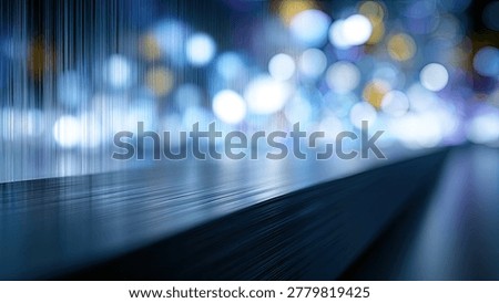 A close-up view of a textured surface in the foreground with blurred, out-of-focus blue and yellow bokeh lights in the background, suggesting a vibrant city at night.