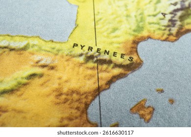 A close-up view of a topographical map highlights parts of Western Europe, specifically Spain and Portugal The Pyrenees mountain range is prominently displayed as the border with France The terrain