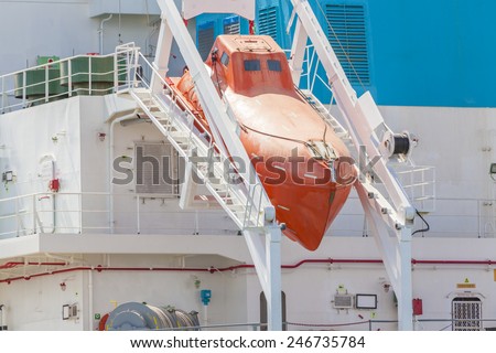 Close-up view of a totally enclosed freefall lifeboat on a downward sloping slipway