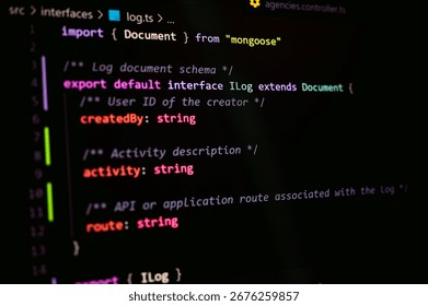 Close-up view of TypeScript Log interface code using Mongoose for MongoDB schema, showing export default interface, string types, and application API structure in software development project.