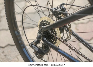 Closeup View Of A Used And Dirty Road Bicycle Cassette And Brakes On A Rear Wheel