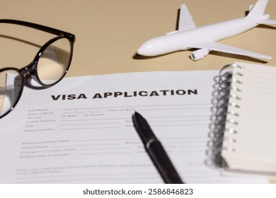 A close-up view of a visa application form on a desk, signifying travel planning, border control, and legal requirements.