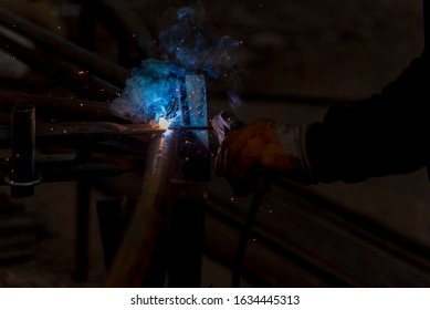 Close-up View Of The Welding Fume. The Welder Welds The Fillet. Fillet Weld Refers To The Process Of Joining By Combining Two Pieces Of Metal, Whether They Are At An Angle Or At An Angle.