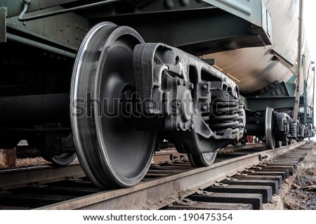 A closeup view of the wheels of a train