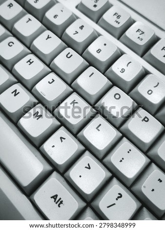 Close-up view of white computer keyboard keys with a clean and minimal design.