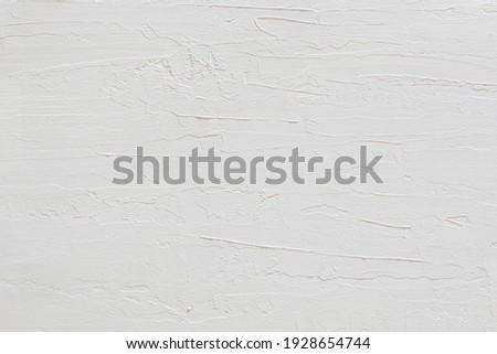 close-up view of a white stucco wall texture