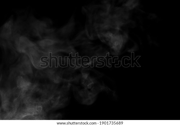 Close-up view of white water vapor
with spray from the humidifier. Isolated on black
background