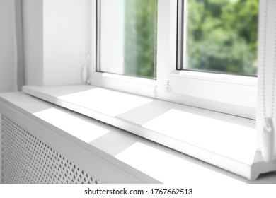 Closeup View Of Window With Empty White Sill