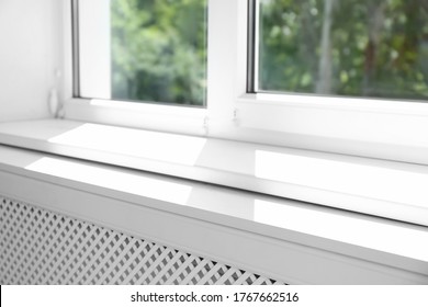 Closeup View Of Window With Empty White Sill