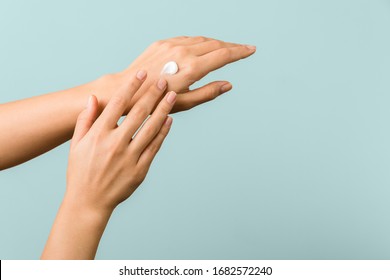 Closeup View Of Woman Hands Applying Hand Cream. Beauty Shot