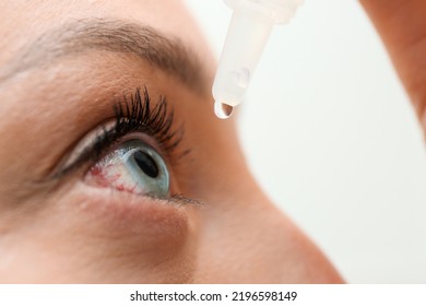 Closeup View Of Woman Using Eye Drops