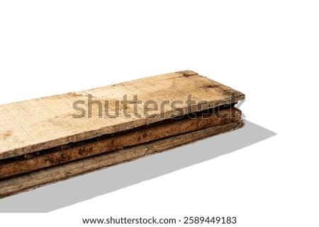 Closeup view of wood plank stack isolated over white background. Natural wooden texture