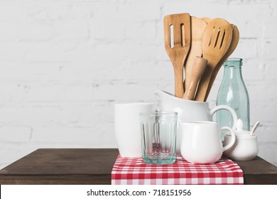 close  up view wooden cooking utensils   cookware table in kitchen 