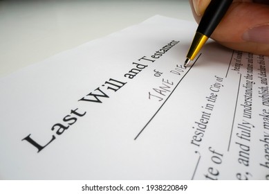 Close-up view of writing a last will with placeholder name, shot with macro probe lens - Shutterstock ID 1938220849