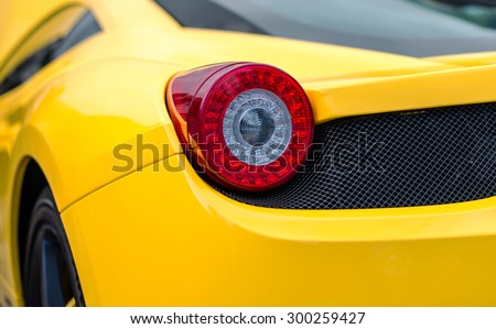 Close-up view of yellow sports car rear light.