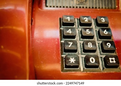 Close-up of vintage burgundy old  classic retro telephone. it does not work anymore. - Powered by Shutterstock