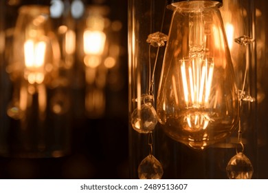 Close-up of vintage Edison bulbs glowing warmly against a blurred cityscape. Ideal for illustrating ambiance, interior design, and urban nightlife. Perfect for blogs, advertisements, or design project - Powered by Shutterstock