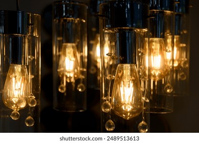 Close-up of vintage Edison bulbs glowing warmly against a blurred cityscape. Ideal for illustrating ambiance, interior design, and urban nightlife. Perfect for blogs, advertisements, or design project - Powered by Shutterstock