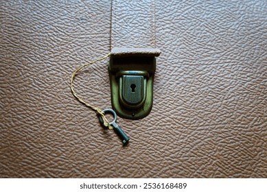 Closeup of Vintage Lock and Key on 1950s Erika Model 10 Typewriter Briefcase - Powered by Shutterstock