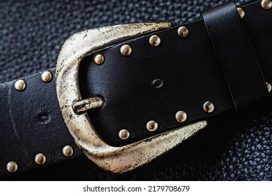 Closeup Of Vintage Metal Buckle And Rivets Of Leather Belt On Dark Background, Fashion Accessories