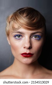 Close-up Vintage Style Portrait Of Young Beautiful Girl With Fancy Hairdo And Blue Mascara, Soft Focus